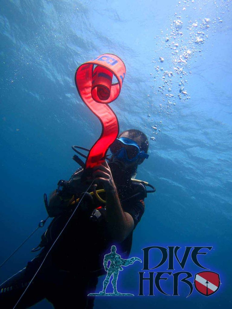 SMB use is an important part of Safe Diving. A PADI Divemaster does this to let his boat know where he.