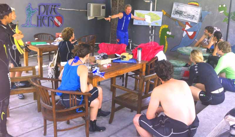 Dive Hero co-founder Max gives a pre-dive briefing to Project AWARE volunteers before a Dive Against Debris