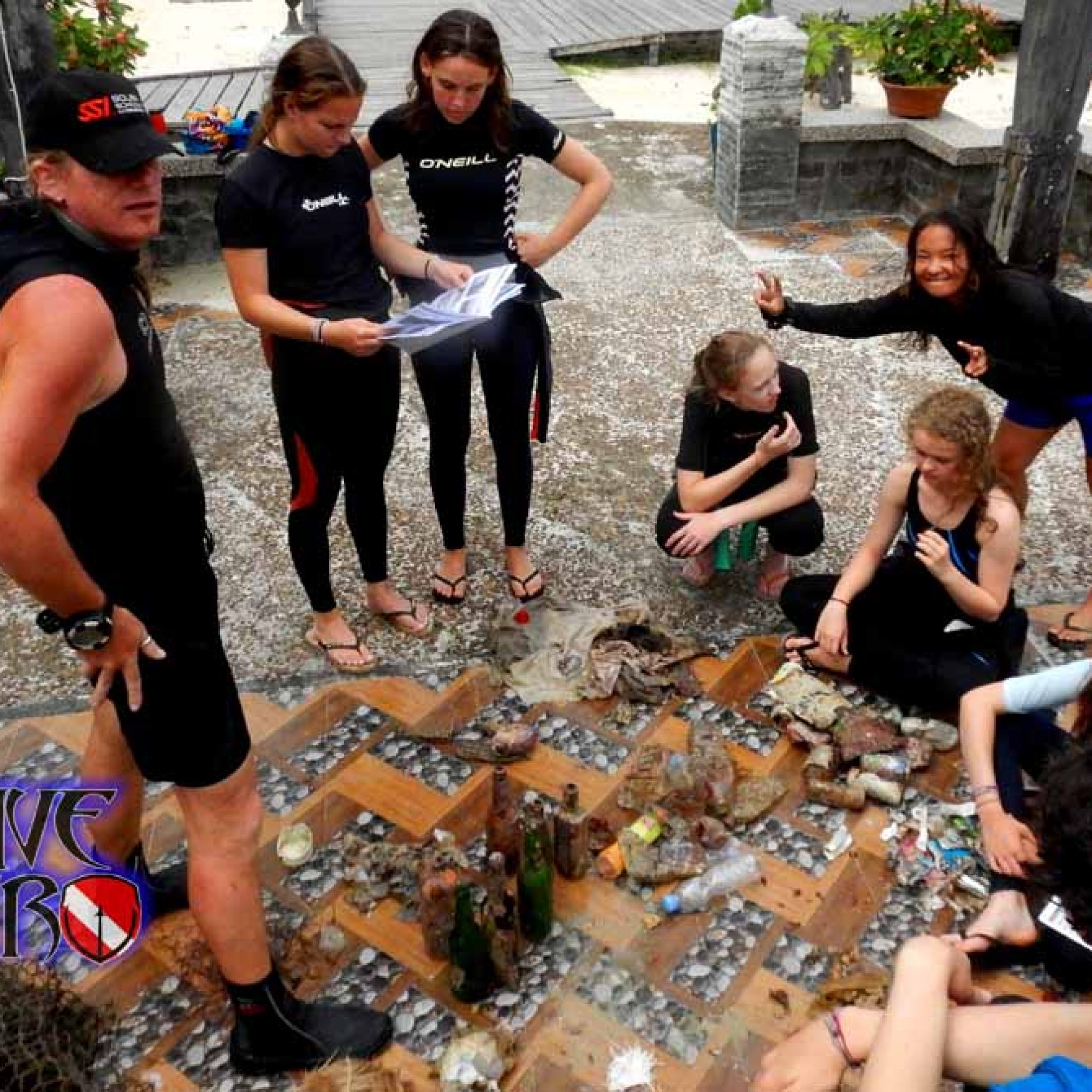 Volunteers sort marine debris after a Dive Against Debris so they can record and report the data to Project AWARE