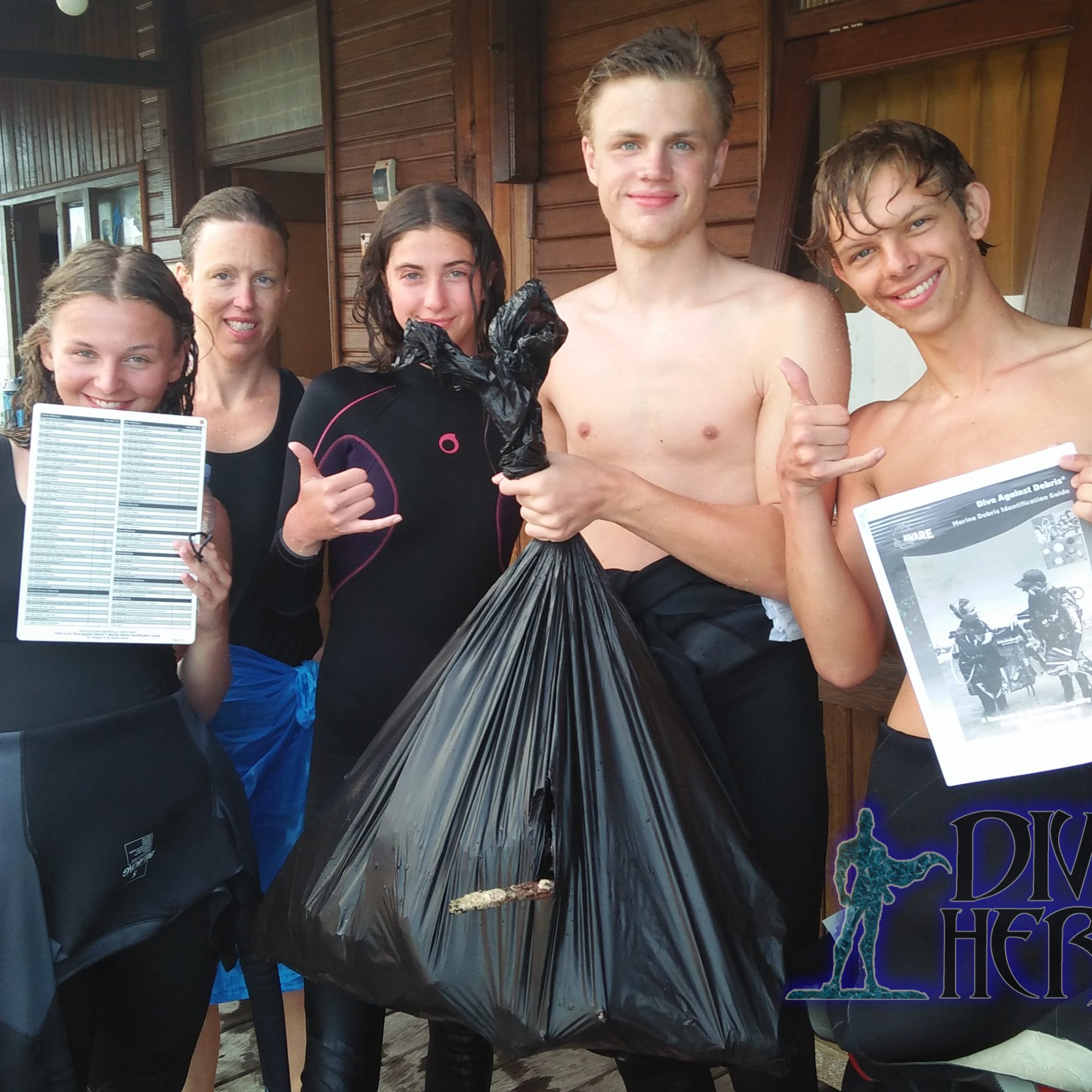 Some Project Aware Dive Against Debris divers after their dive with rubbish ready to be sorted