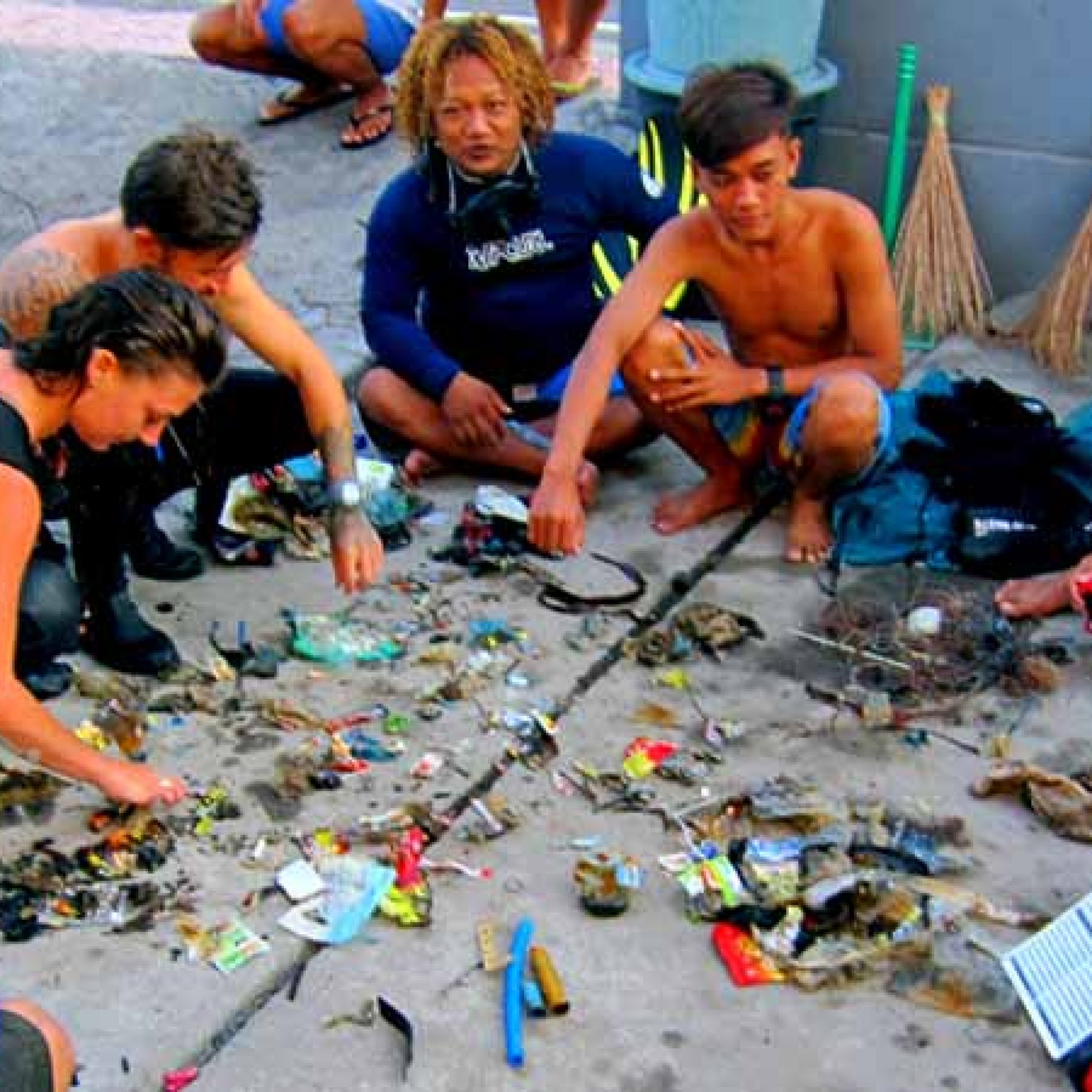 a group of Project Aware Dive Against Debris sort out the debris they collected